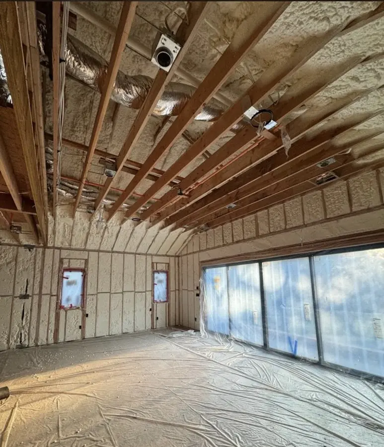 Interior walls and ceiling insulated with spray foam during new construction in Albany